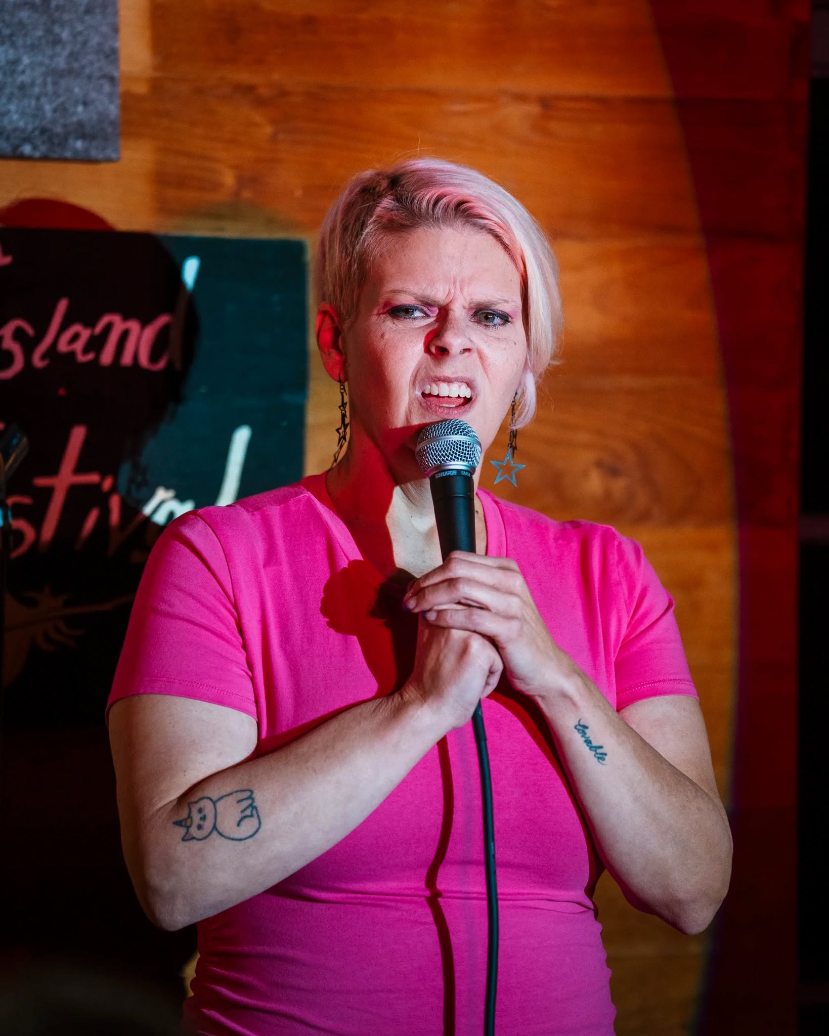 Meredith Kerr on stage at a comedy festival
